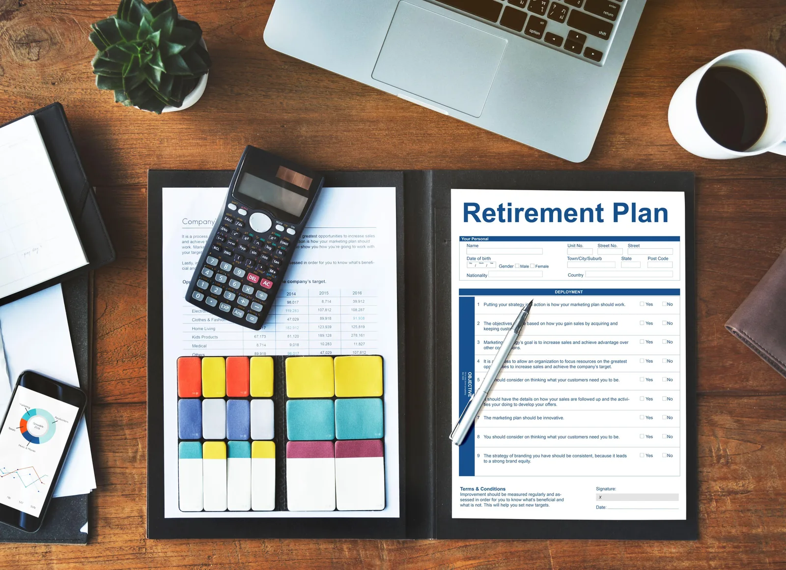 Retirement planning documents and financial records on a desk